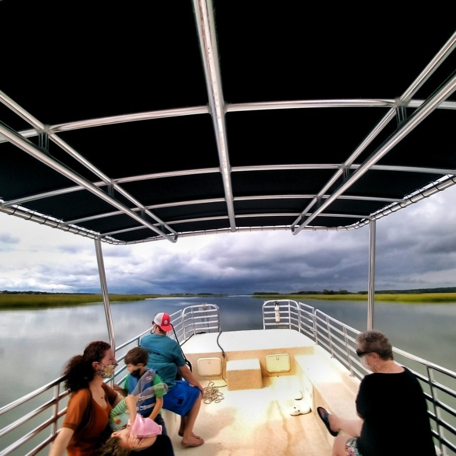 a group of people on a bridge over a body of water