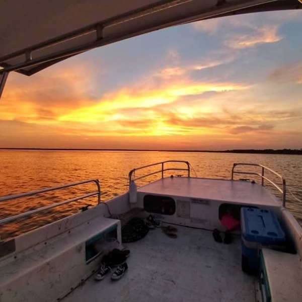 a boat is docked next to a body of water