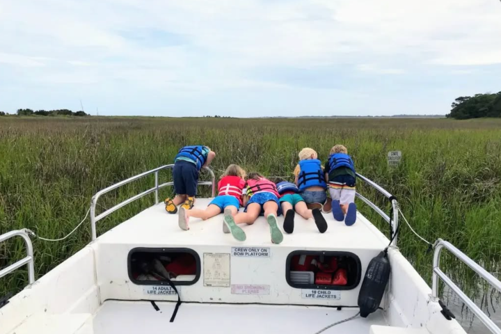 a group of people riding on the back of a truck