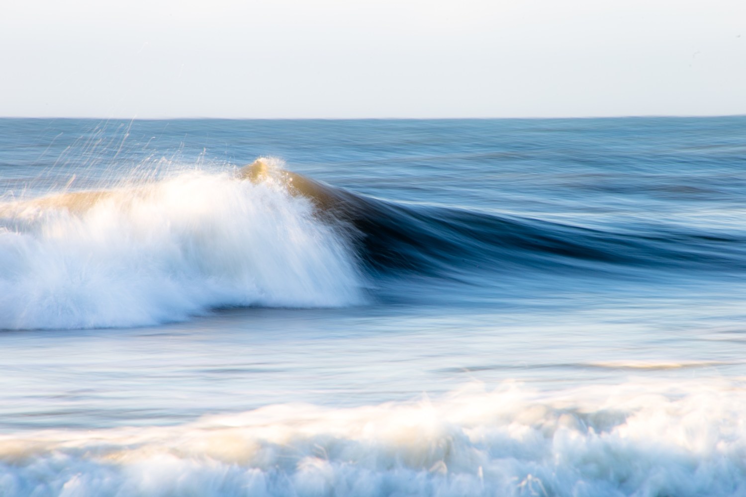 a person riding a wave in the ocean